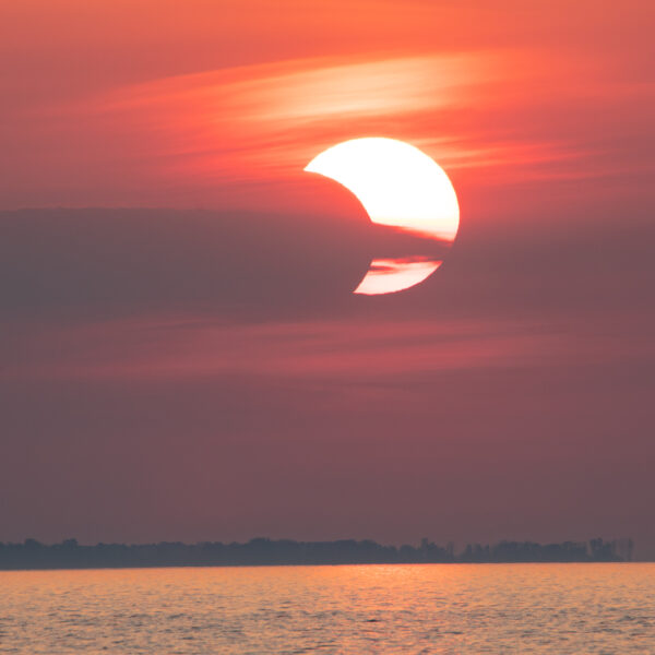 Partial solar eclipse above the Bay of Green Bay - 10 June 2021, 0515CDT
